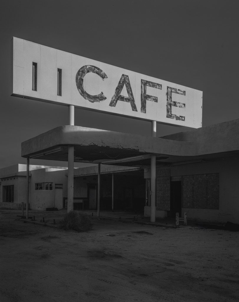Black and white picture of an abandoned cafe