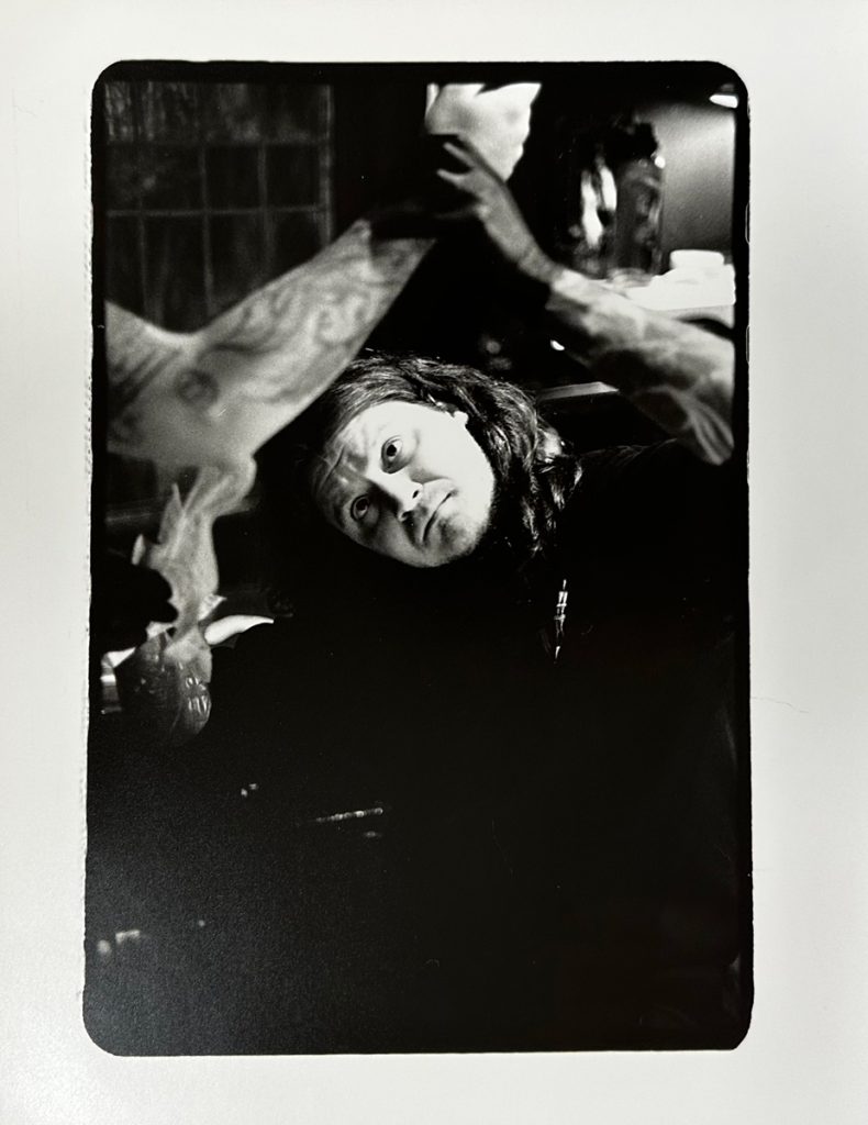 man checking his tattoo