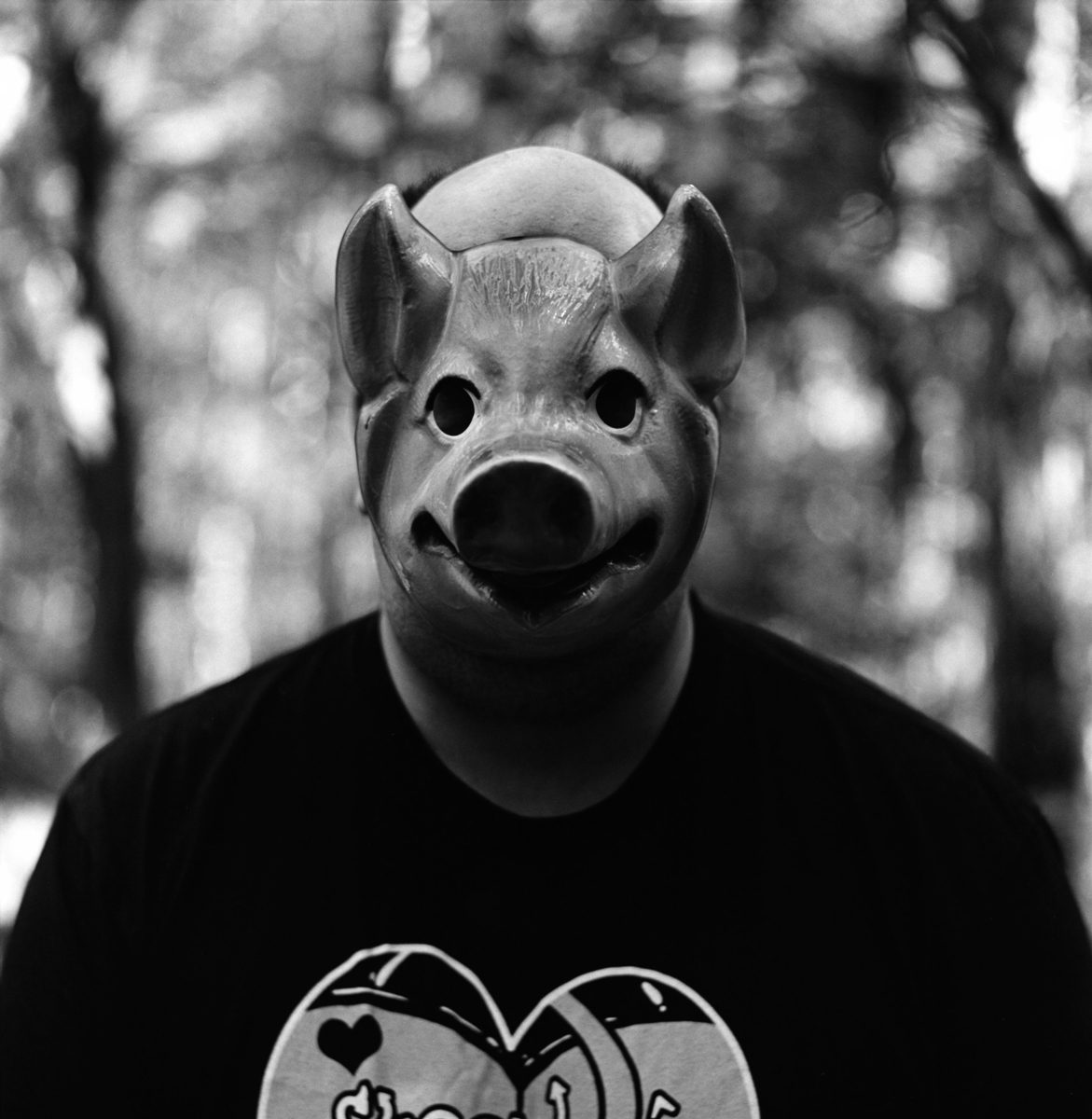 Back and white photo of person in pig mask shot by Peggy Marsh on ILFORD HP5 PLUS black and white film