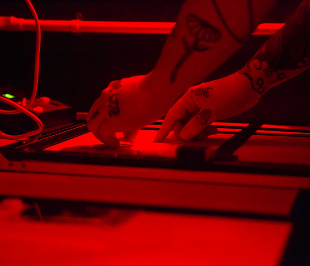 Darkroom prints being developed at Negative Development community darkroom