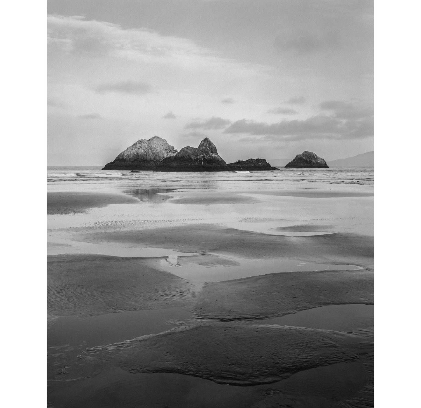 stephan.morais.foto • Ocean Beach, San Francisco Seal Rocks from Ocean Beach at low tide. Shot with the Chamonix 45F-2 on Ilford Delta 100. . . . @ilfordphoto #fridayfavourites